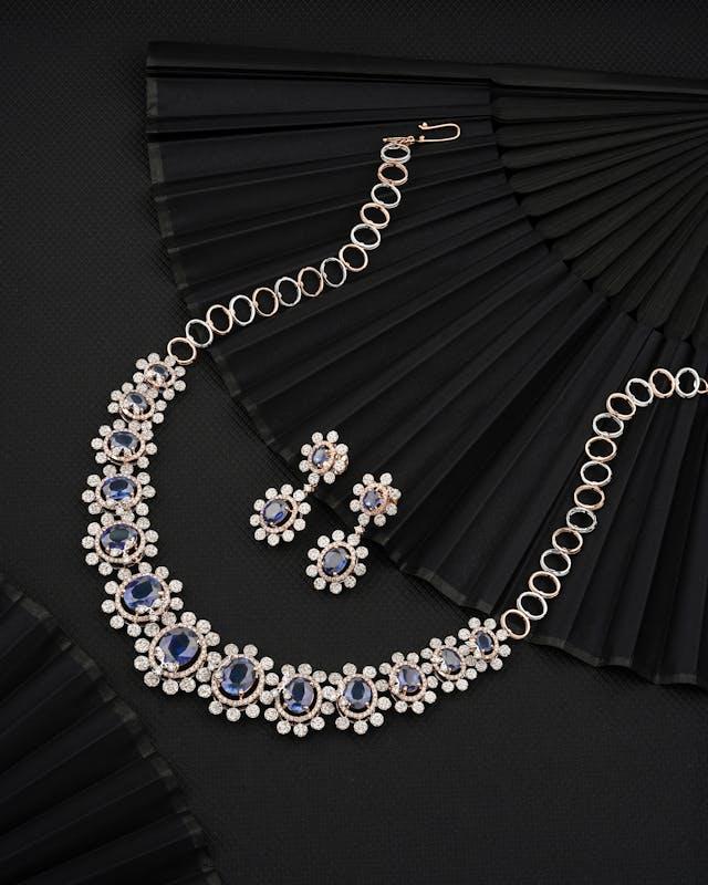 a silver necklace with sapphire crystals look